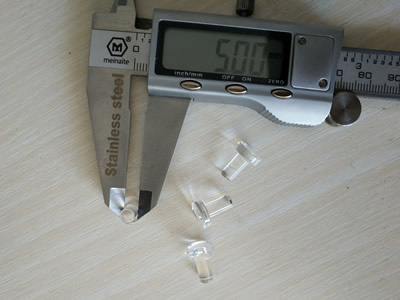 The outer diameter of the upper end of a glass light guide measured with vernier caliper is 5 mm.