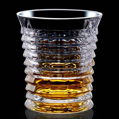 This is a type E whiskey glass cup that is filled with whiskey wines.