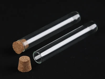 A closed and an opened laboratory culture tube with cone shape cork stopper on the black background.