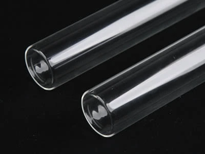 Two laboratory culture tubes with flat bottom on the black background.